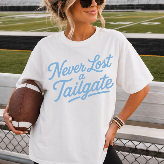Never Lost a Tailgate Baby Blue Graphic Tee – Carolina Blue Football Game Day Shirt